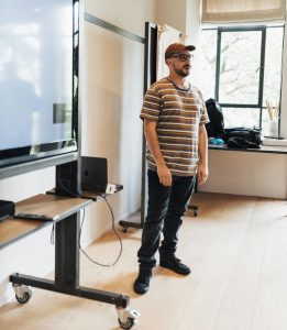 A man giving a presentation or best man's speech with confidence